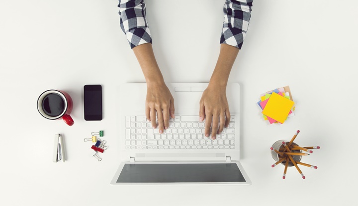 Businesswoman Working At Notebook