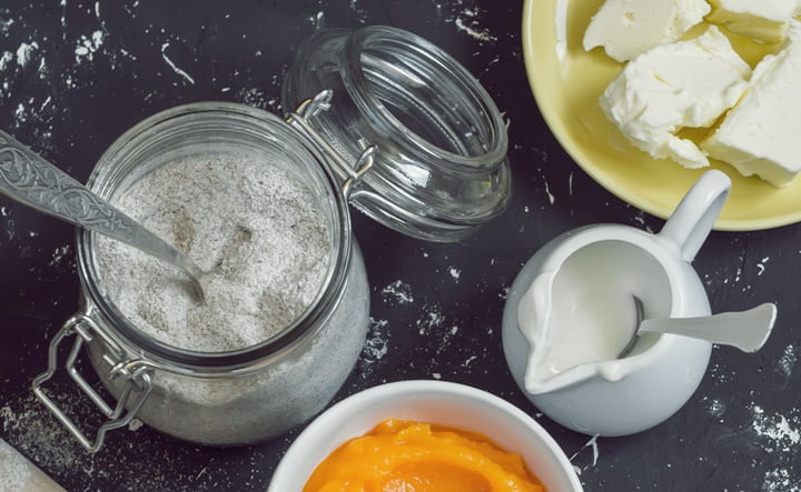 Raw baking ingredients - pumpkin puree, butter, flour, eggs, cream