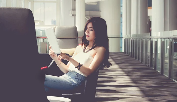 woman using digital tablet