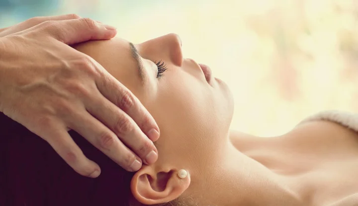 Woman having facial massage.