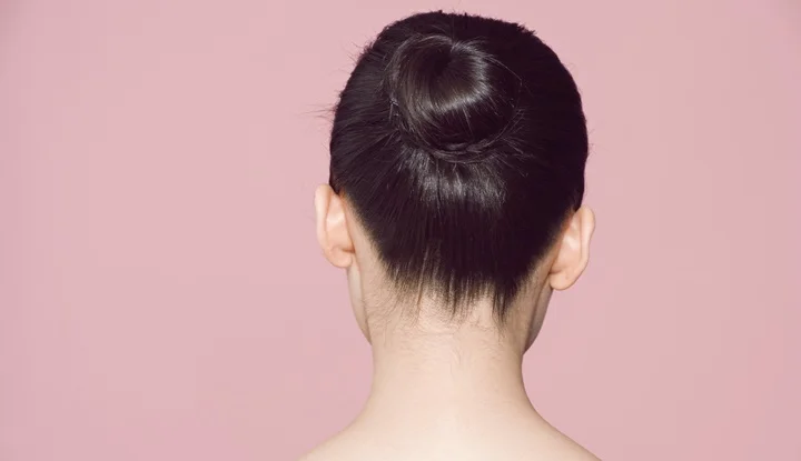 Back view of woman with hair in bun