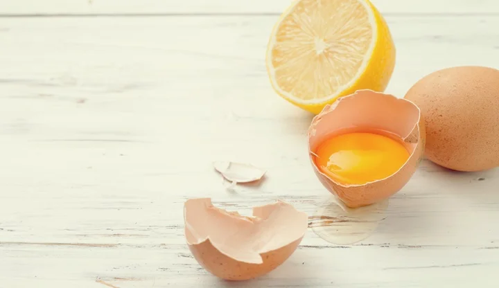 eggs, lemon to prepare homemade food and cosmetics on whitte